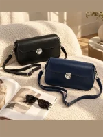 Women's classic rectangular shoulder bag with silver metal clasp and adjustable strap in black and navy blue