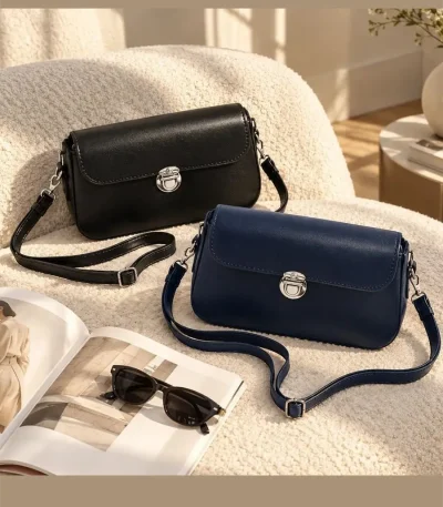 Women's classic rectangular shoulder bag with silver metal clasp and adjustable strap in black and navy blue
