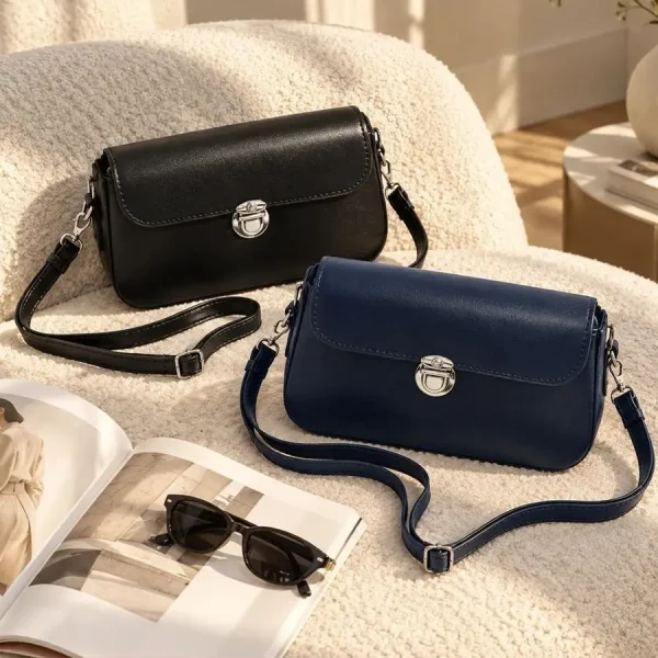 Women's classic rectangular shoulder bag with silver metal clasp and adjustable strap in black and navy blue
