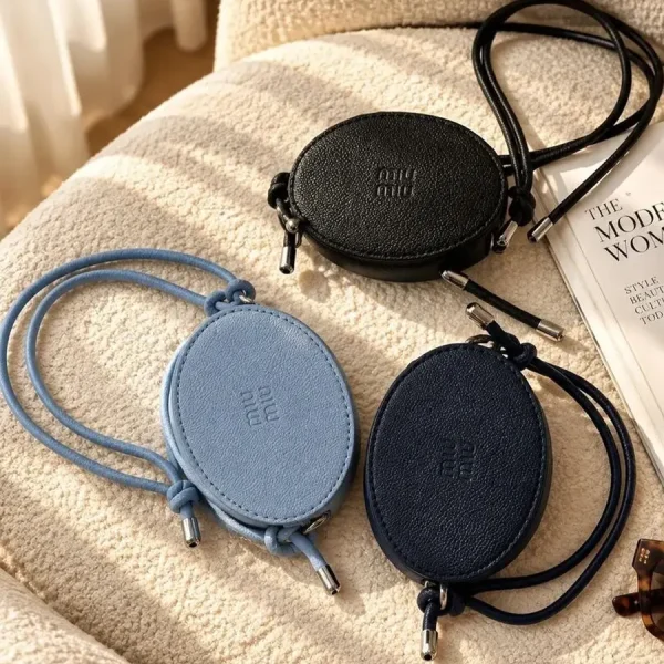 Women's Miu Miu mini bag with adjustable strap available in black, navy blue, and blue