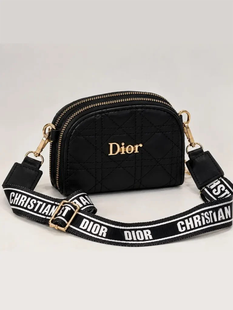 Black women's Dior mini bag with diamond quilting, gold-tone details, and wide printed strap